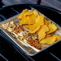 Talkin' Tacos quesadillas and tortilla chips served on a metal tray with branded paper.